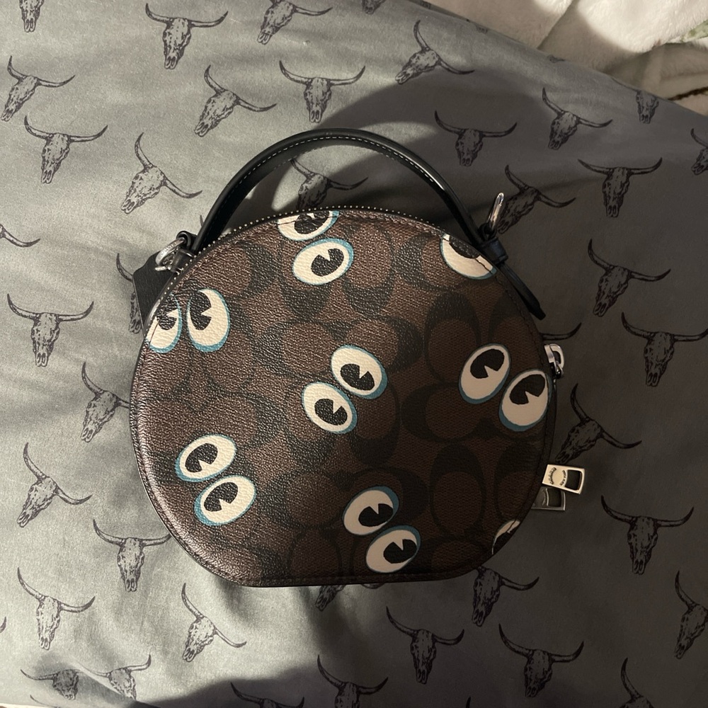 Playful coach Eye-Pattern Mini Bag in Black and Brown